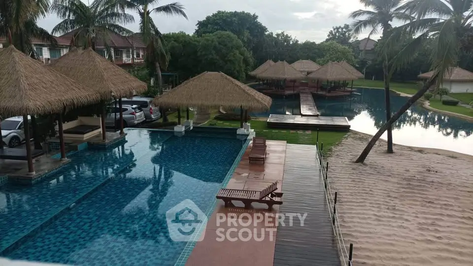 Luxurious tropical resort with stunning pool and cabanas, perfect for relaxation and leisure.