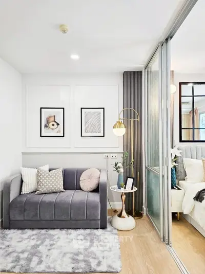 Stylish modern living room with cozy gray sofa and elegant decor