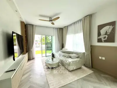 Modern living room with large windows and stylish decor