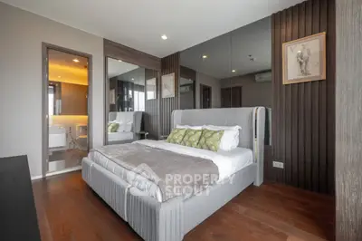 Modern bedroom with stylish decor and wooden flooring