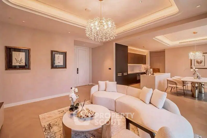 Luxurious open-plan living room with elegant chandelier and modern decor
