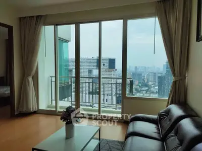 Spacious living room with large windows offering stunning city views in a modern apartment.