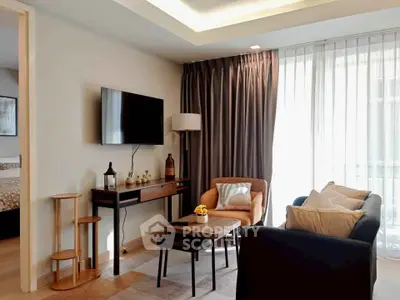 Stylish living room with modern furniture and natural light, perfect for relaxation and entertainment.