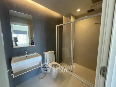 Modern bathroom with sleek shower and elegant fixtures