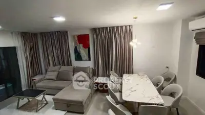 Modern living room with elegant dining area and stylish decor