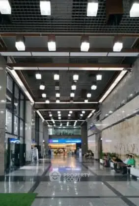 Spacious modern building entrance with high ceilings and sleek design