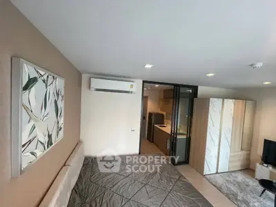 Modern bedroom with stylish decor and air conditioning in a contemporary apartment.