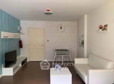 Charming living room with modern decor and cozy seating area.