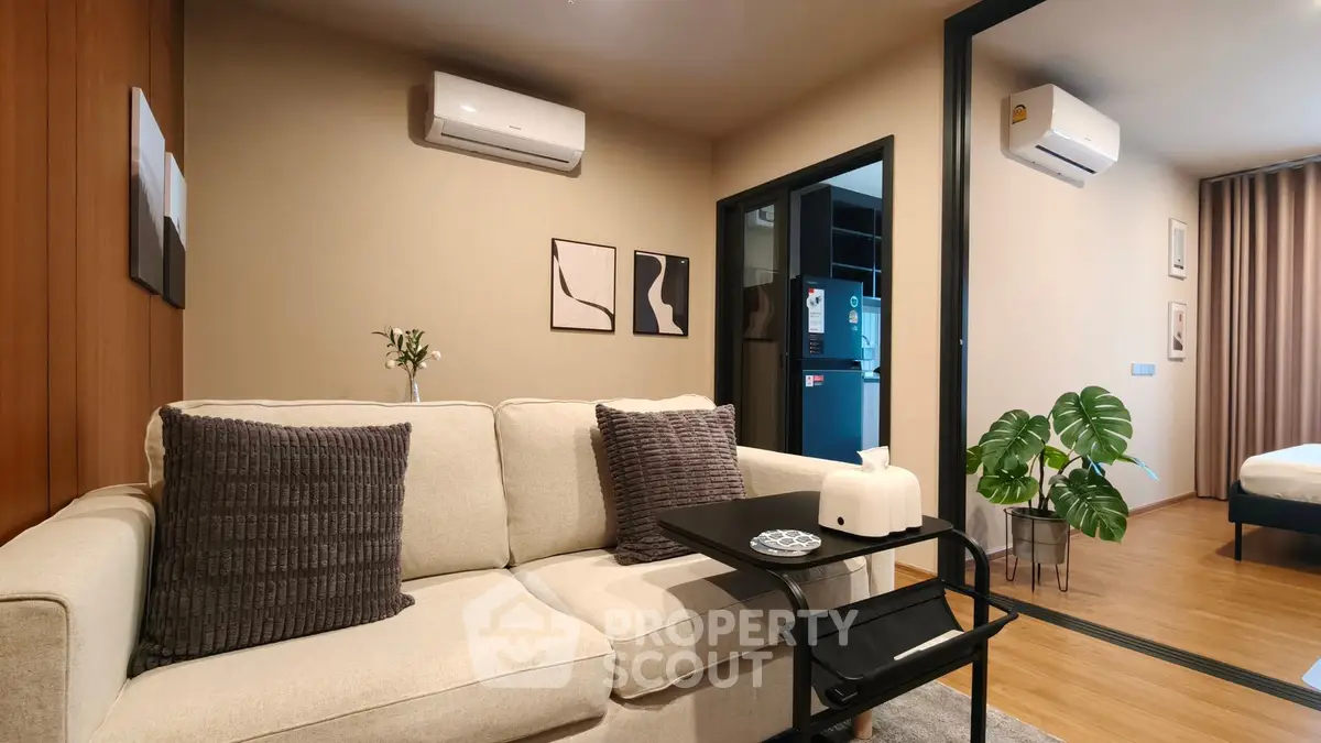 Modern living room with cozy sofa and air conditioning in stylish apartment