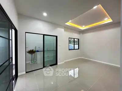 Modern living room with sleek tile flooring and recessed lighting