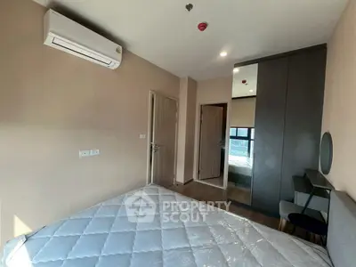 Modern bedroom with air conditioning and stylish furniture in a cozy apartment