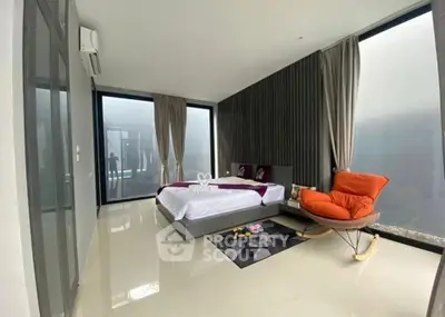 Luxurious modern bedroom with floor-to-ceiling windows and stylish decor