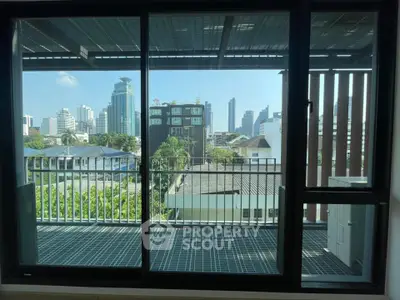 Spacious balcony with city skyline view, perfect for urban living enthusiasts.