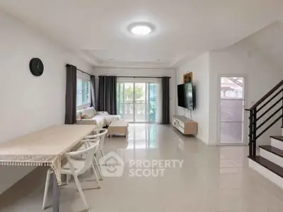 Spacious modern living room with natural light and stylish decor