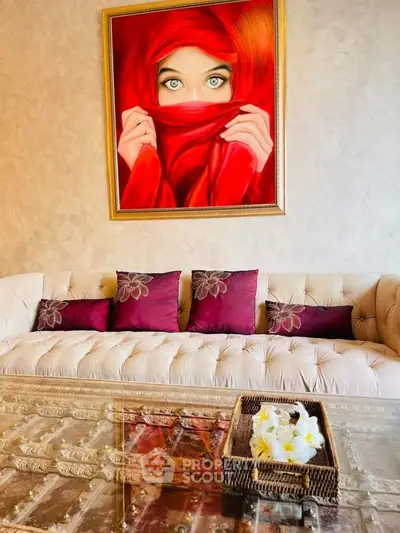 Elegant living room with plush sofa and striking artwork, perfect for stylish interiors.
