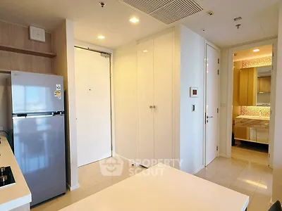 Modern apartment interior with sleek kitchen and cozy bedroom view