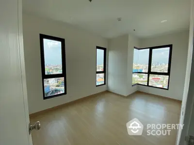 Spacious corner unit with panoramic city views and abundant natural light.