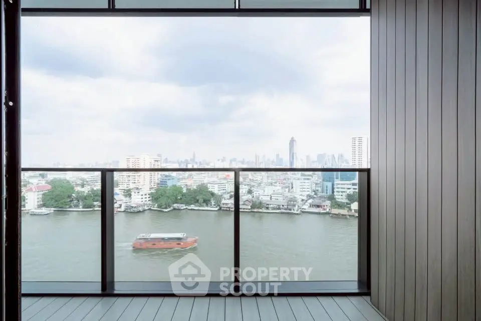 Stunning river view from a modern balcony in a high-rise apartment, perfect for city living.