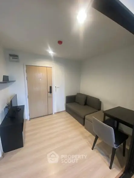 Cozy modern living room with sleek furniture and wooden flooring