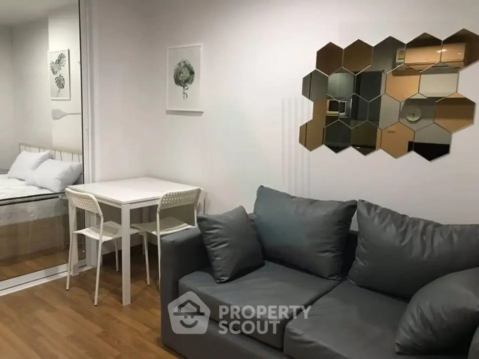 Modern living room with stylish decor and cozy seating in a contemporary apartment.