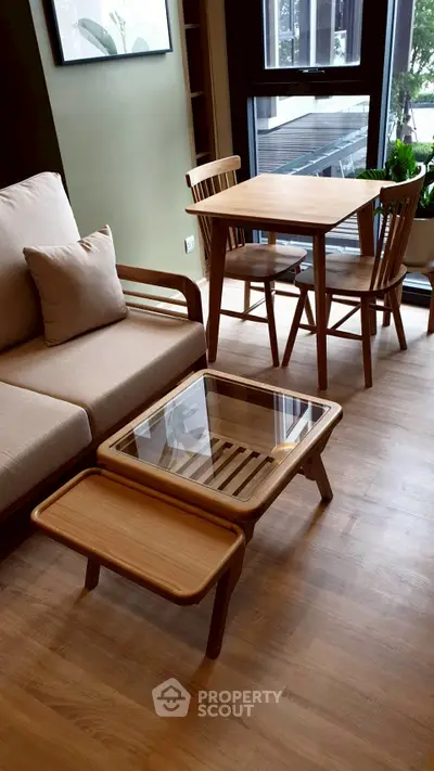 Stylish modern living room with wooden furniture and large window view