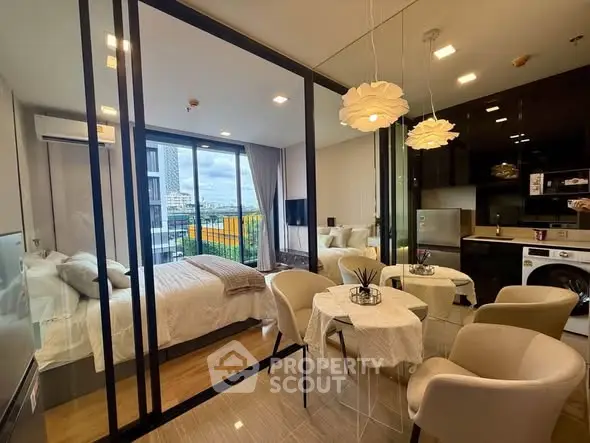 Modern studio apartment with glass partition, cozy dining area, and city view balcony.