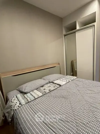 Cozy bedroom with modern decor and mirrored closet doors