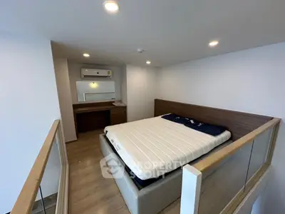 Modern loft bedroom with sleek design and cozy atmosphere