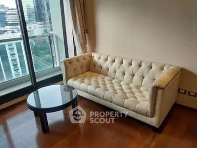 Chic urban living room with elegant sofa and city view