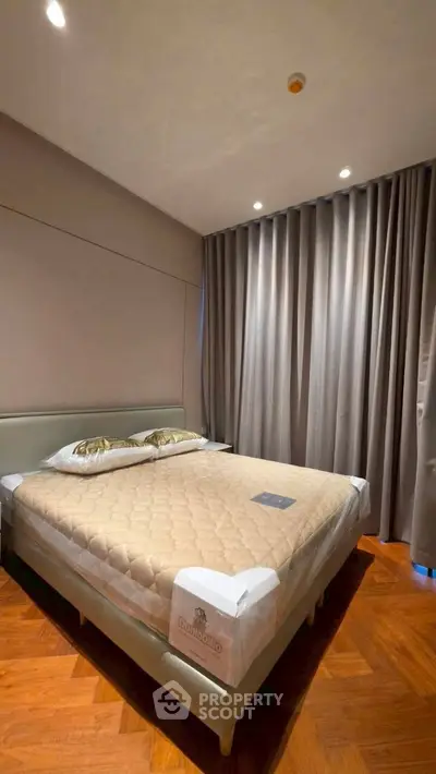 Luxurious bedroom with elegant decor and cozy ambiance, featuring a plush bed and stylish curtains.