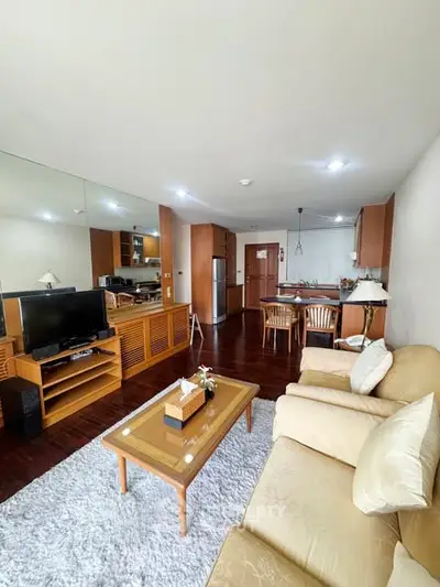 Spacious living room with open kitchen and modern furnishings