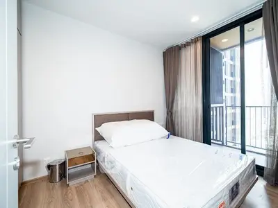 Modern bedroom with balcony access in a stylish apartment