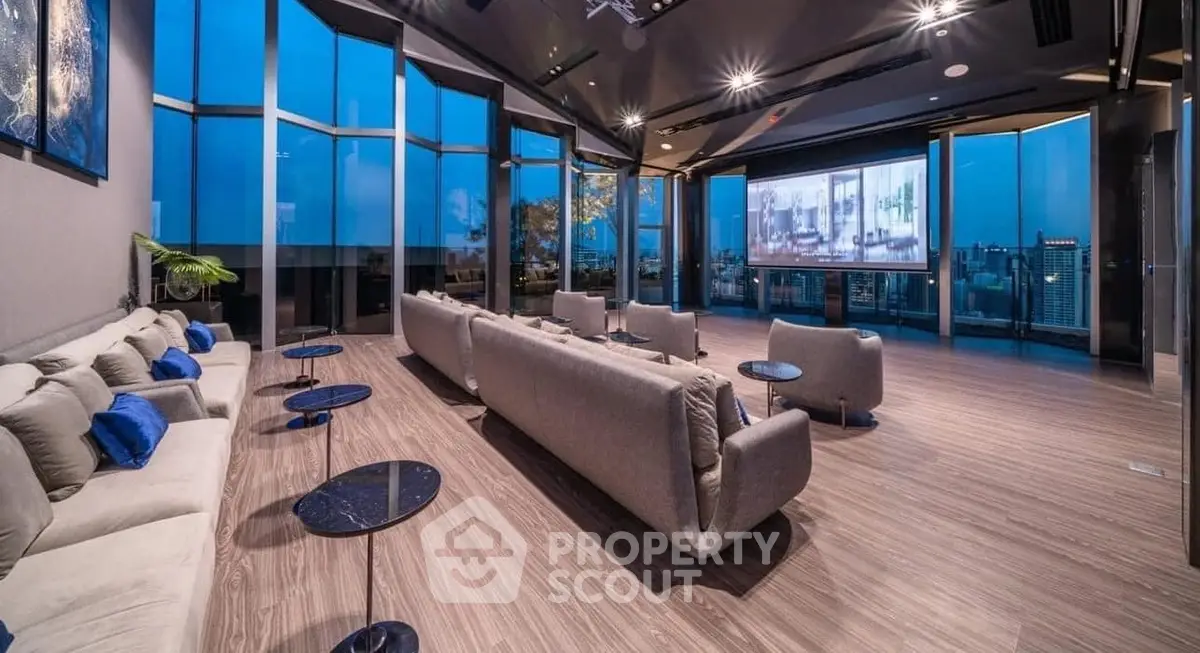 Luxurious penthouse living room with panoramic city views and modern furnishings.