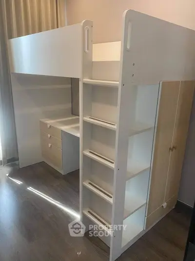 Modern loft bed with integrated desk and storage in a stylish bedroom