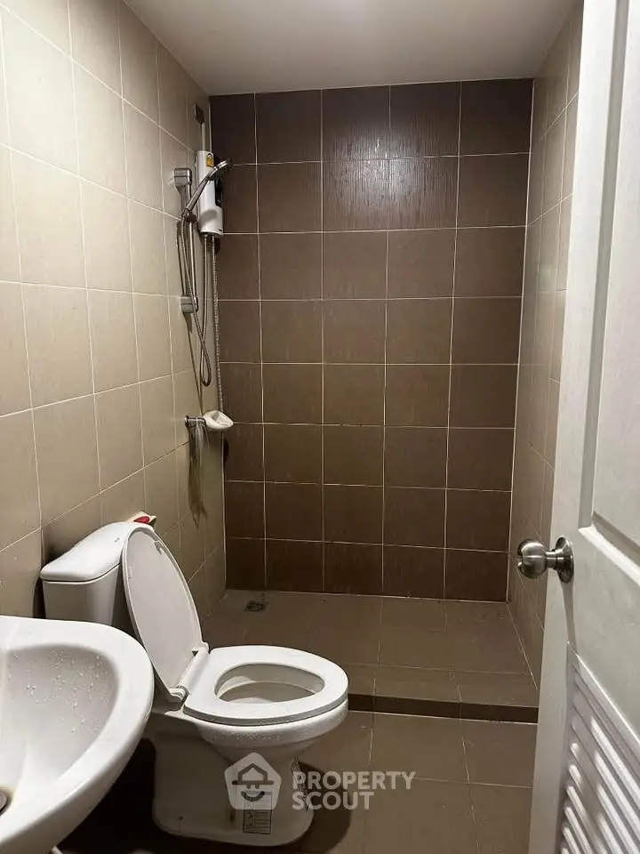 Modern bathroom with sleek tile design and shower area