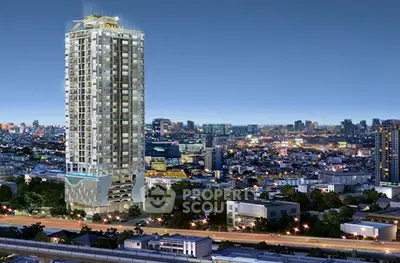 Stunning high-rise building with panoramic city views at night, perfect for urban living.