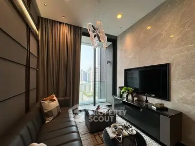 Luxurious living room with modern decor and city view, featuring elegant lighting and stylish furniture.