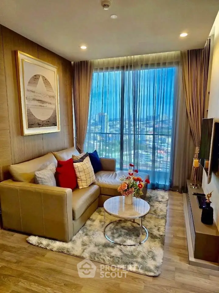 Chic living room with city view, cozy sofa, and modern decor