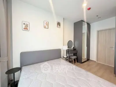 Modern bedroom with stylish decor and ample natural light