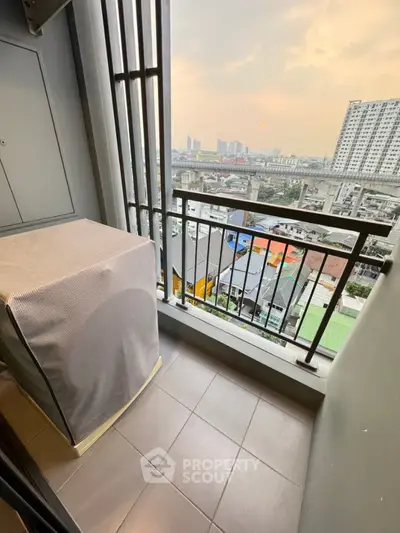 Charming balcony with city view, perfect for relaxation and enjoying sunsets in urban setting.