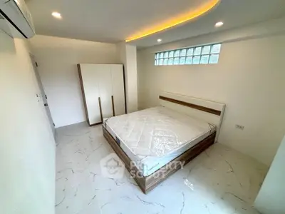 Modern bedroom with stylish design and ample natural light