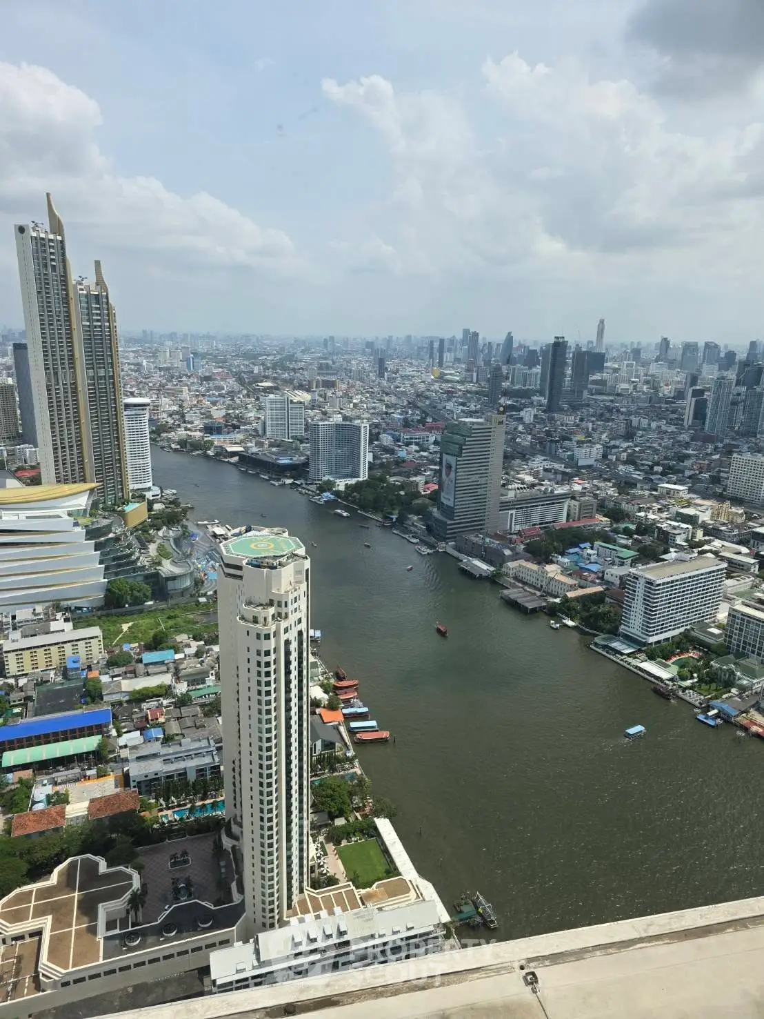 Stunning cityscape view from high-rise building overlooking river and skyline