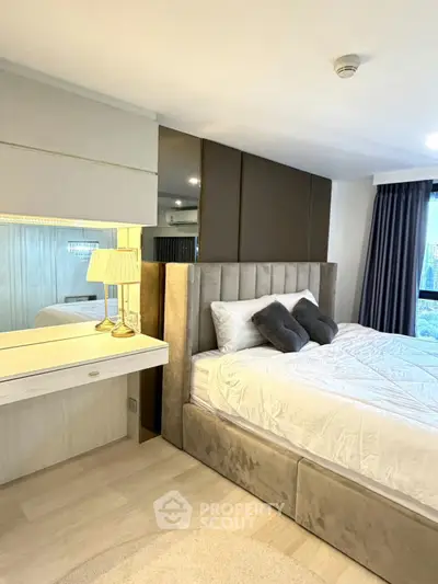 Luxurious bedroom with plush bed and elegant decor in modern apartment