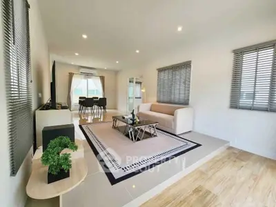 Spacious modern living room with elegant decor and natural light