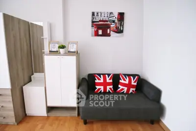 Stylish living room with Union Jack pillows and modern decor