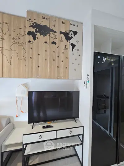 Modern living room with stylish world map decor and sleek TV setup