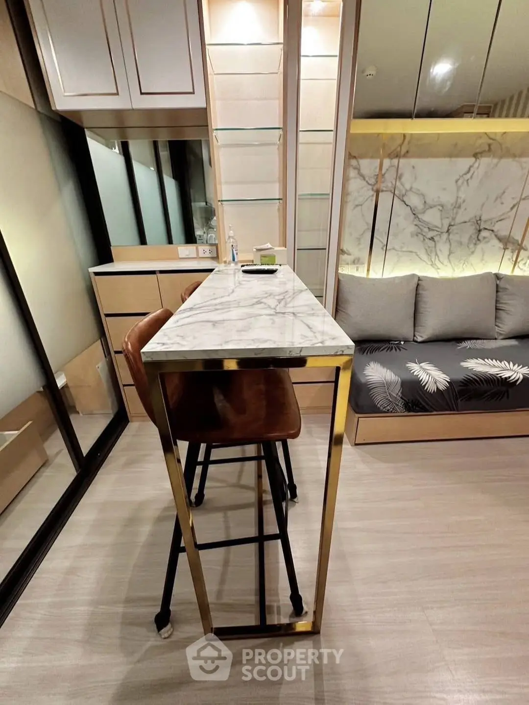 Modern interior with sleek marble table and stylish seating in a contemporary living space.