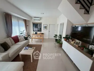 Spacious modern living room with stylish decor and natural light