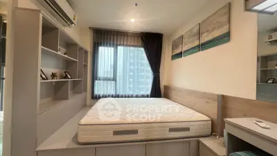 Modern bedroom with built-in storage and large window in urban apartment