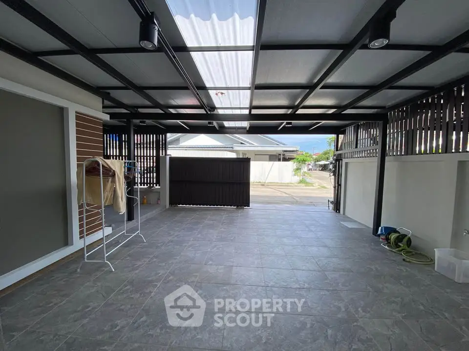Spacious covered garage with modern design and ample natural light